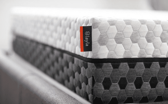 Close-up shot of the dual sided Layla mattress, shows light gray on top and dark gray on bottom.