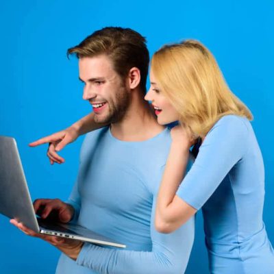 Online shopping. Online-shop. Smiling couple with laptop.
